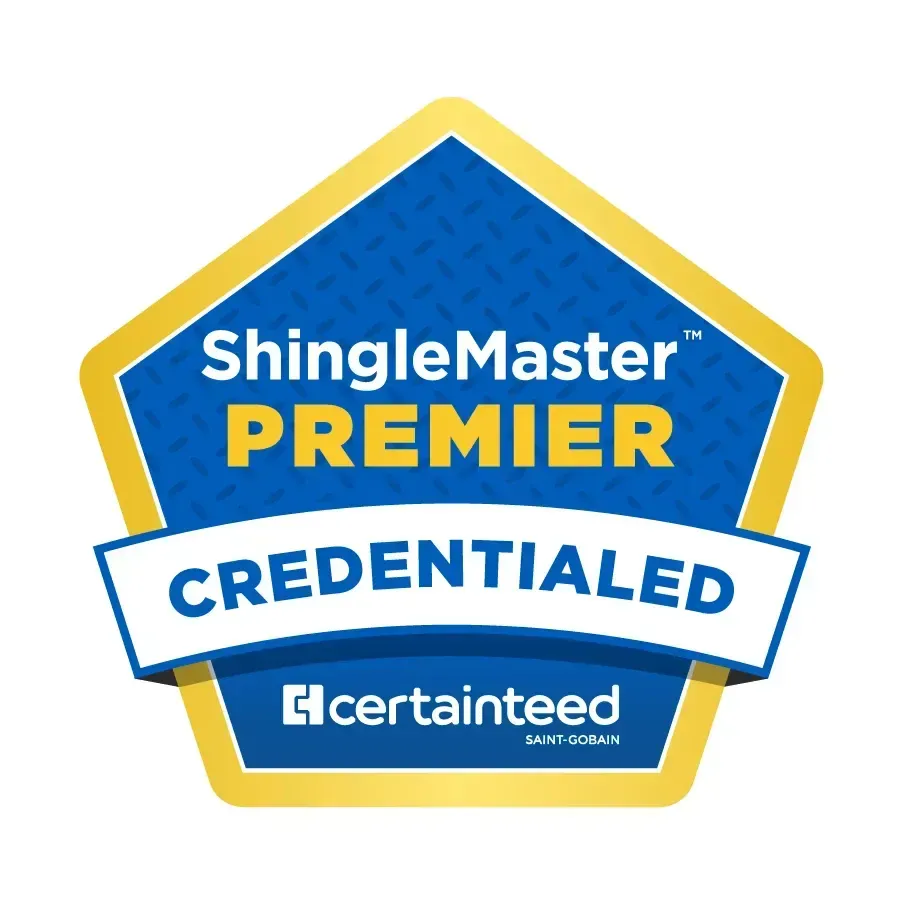 A blue and gold pentagonal logo for CertainTeed ShingleMaster Premier Credentialed roofing contractors.