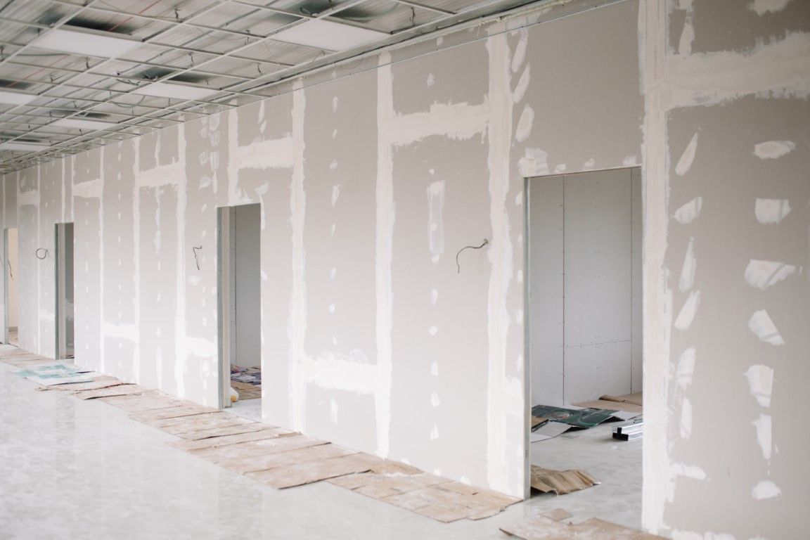 Commercial hallway drywall installation.