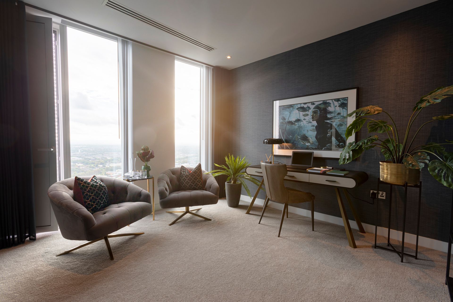 Modern office with two chairs, desk, plants, and large windows with cityscape views.