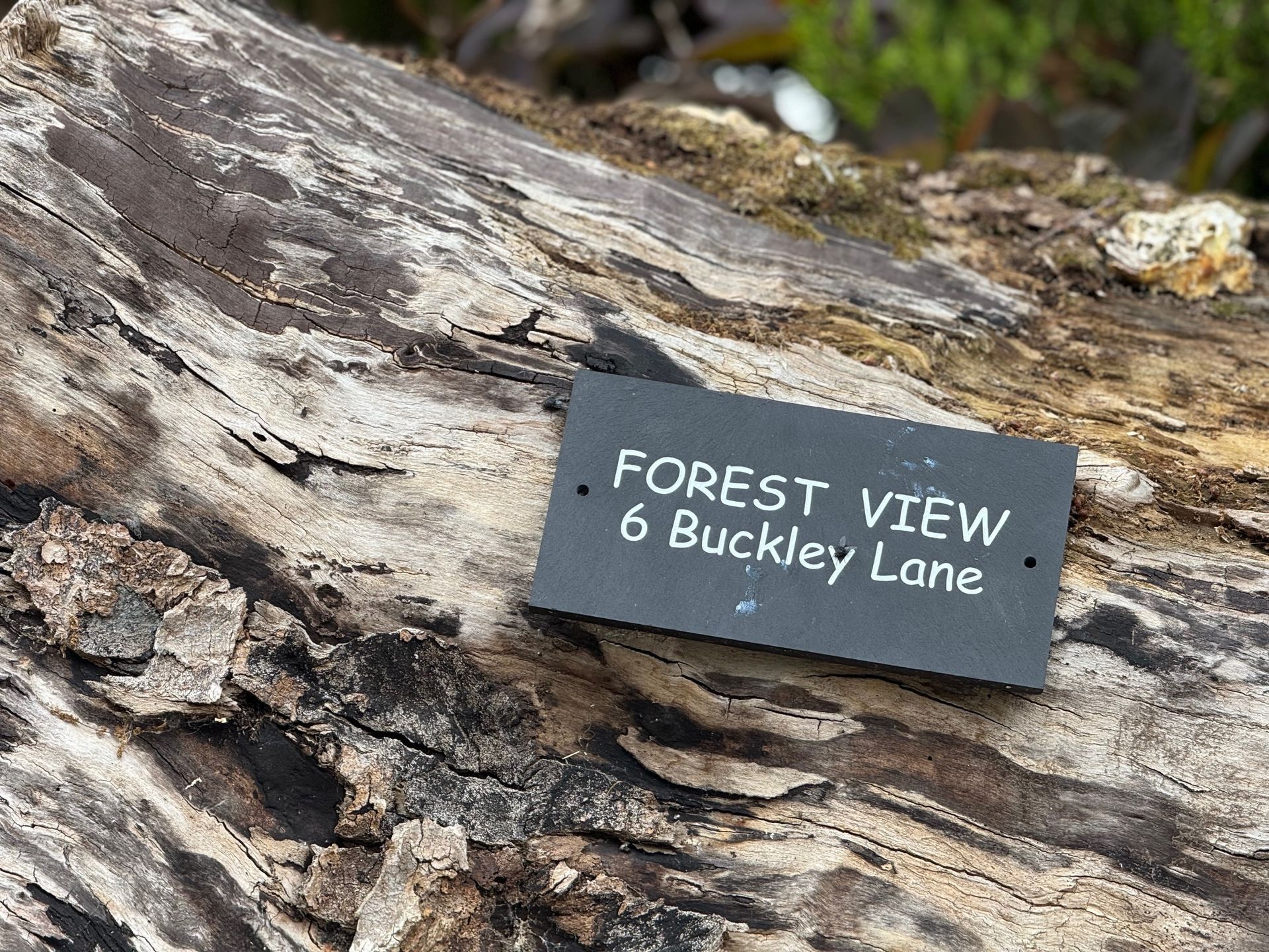 A slate sign that reads