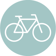 A person is riding a bike in a green circle.