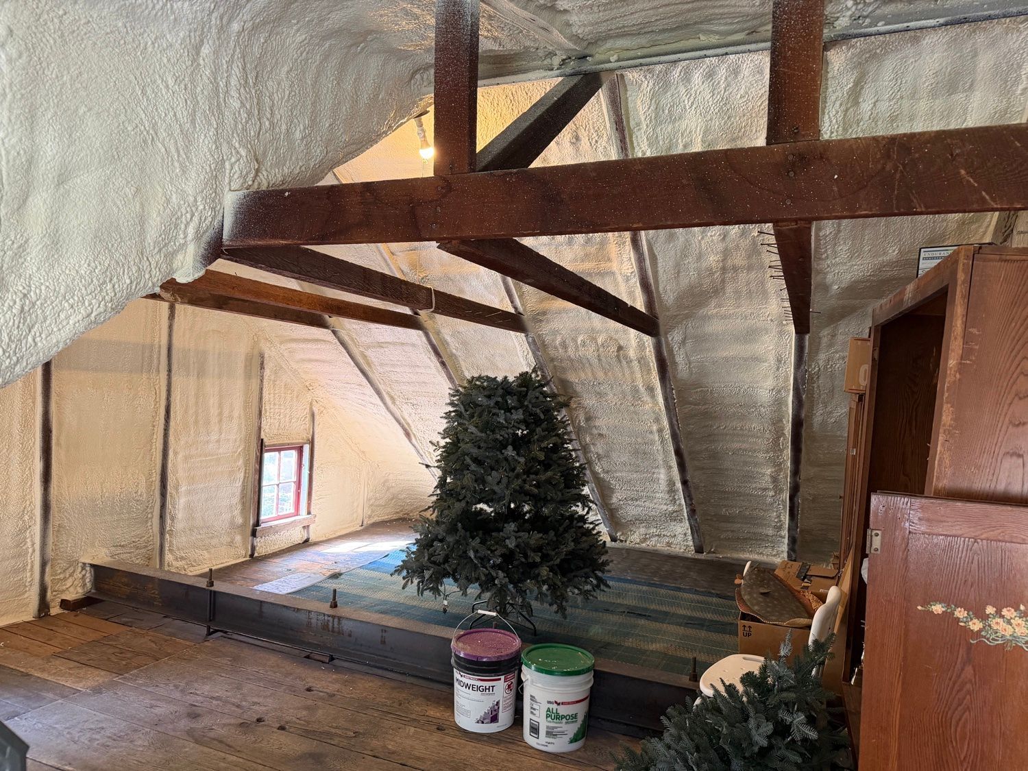 Spray foam insulated attic roof deck around exposed wood beams, Sunrise Valley Spray Foam