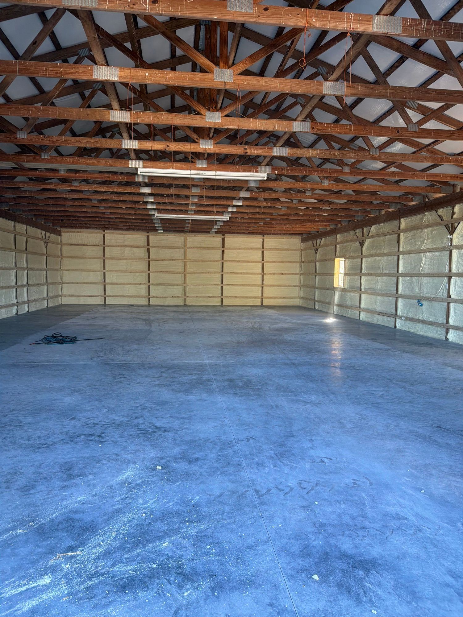 Pole barn interior with closed cell spray foam on the walls, Sunrise Valley Spray Foam