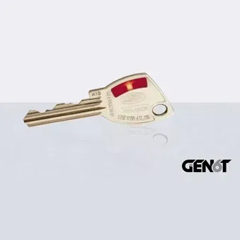 Silver key with red plastic head and GENOT logo on a light background