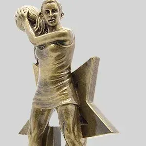 Bronze golfer statue mid-swing on a geometric base