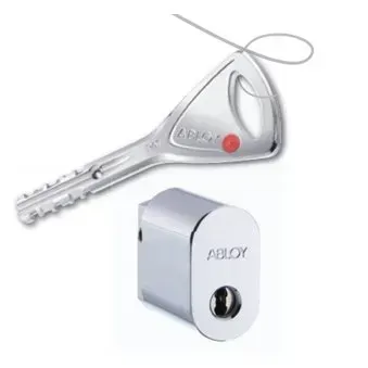 Silver key with red dot and small white ABLOY lock on a plain background