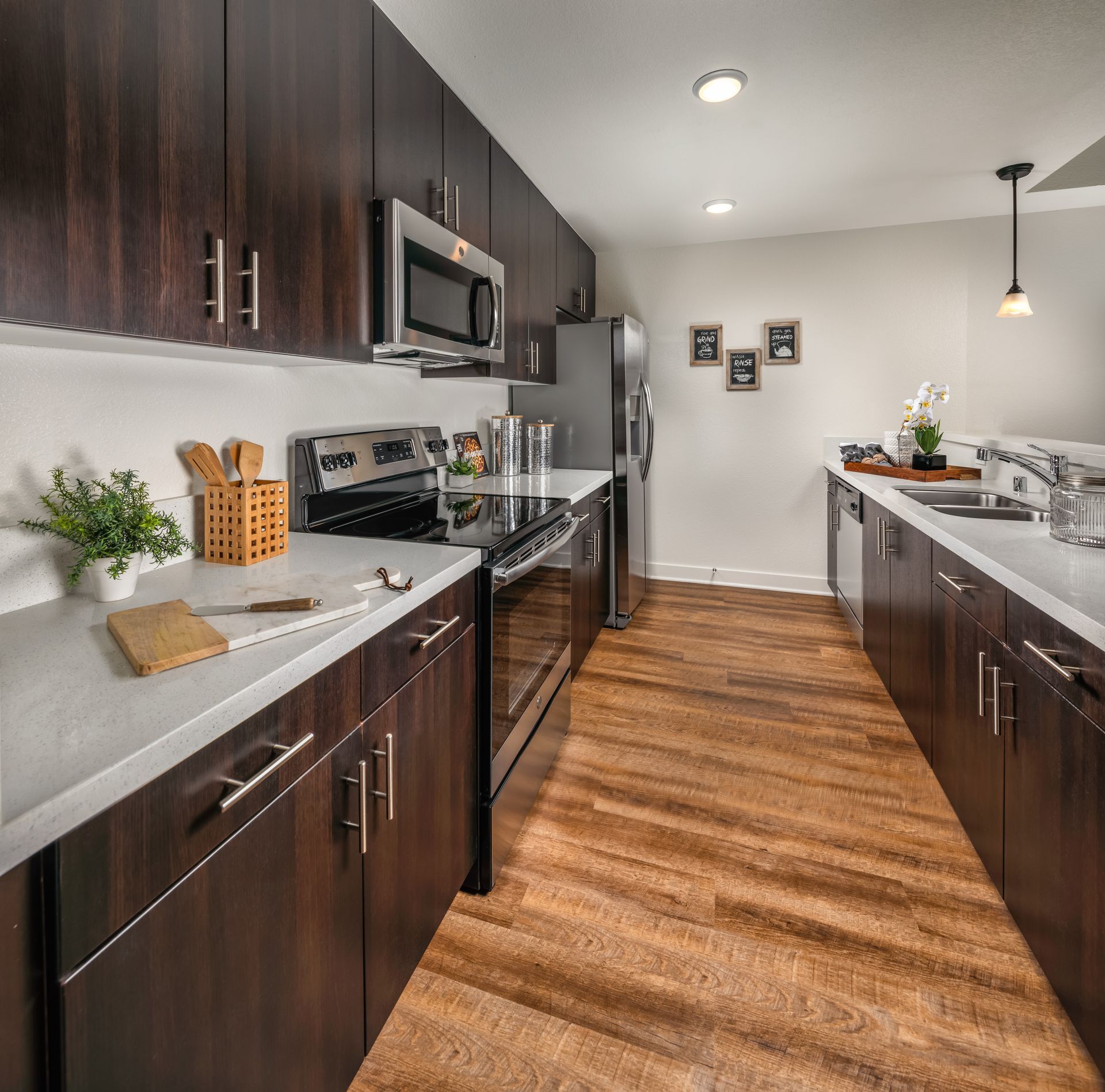 A kitchen with wooden cabinets and stainless steel appliances