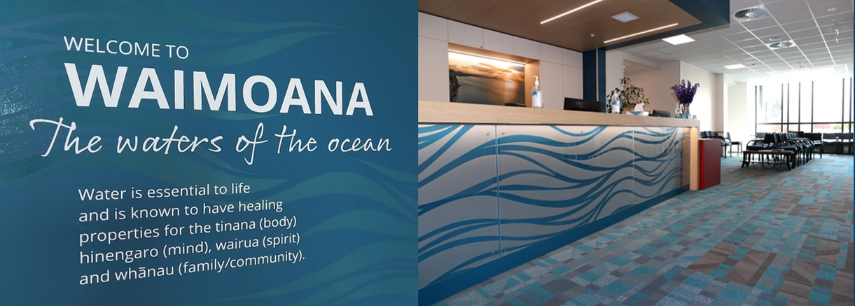A hotel lobby with a sign that says waimona the waters of the ocean.