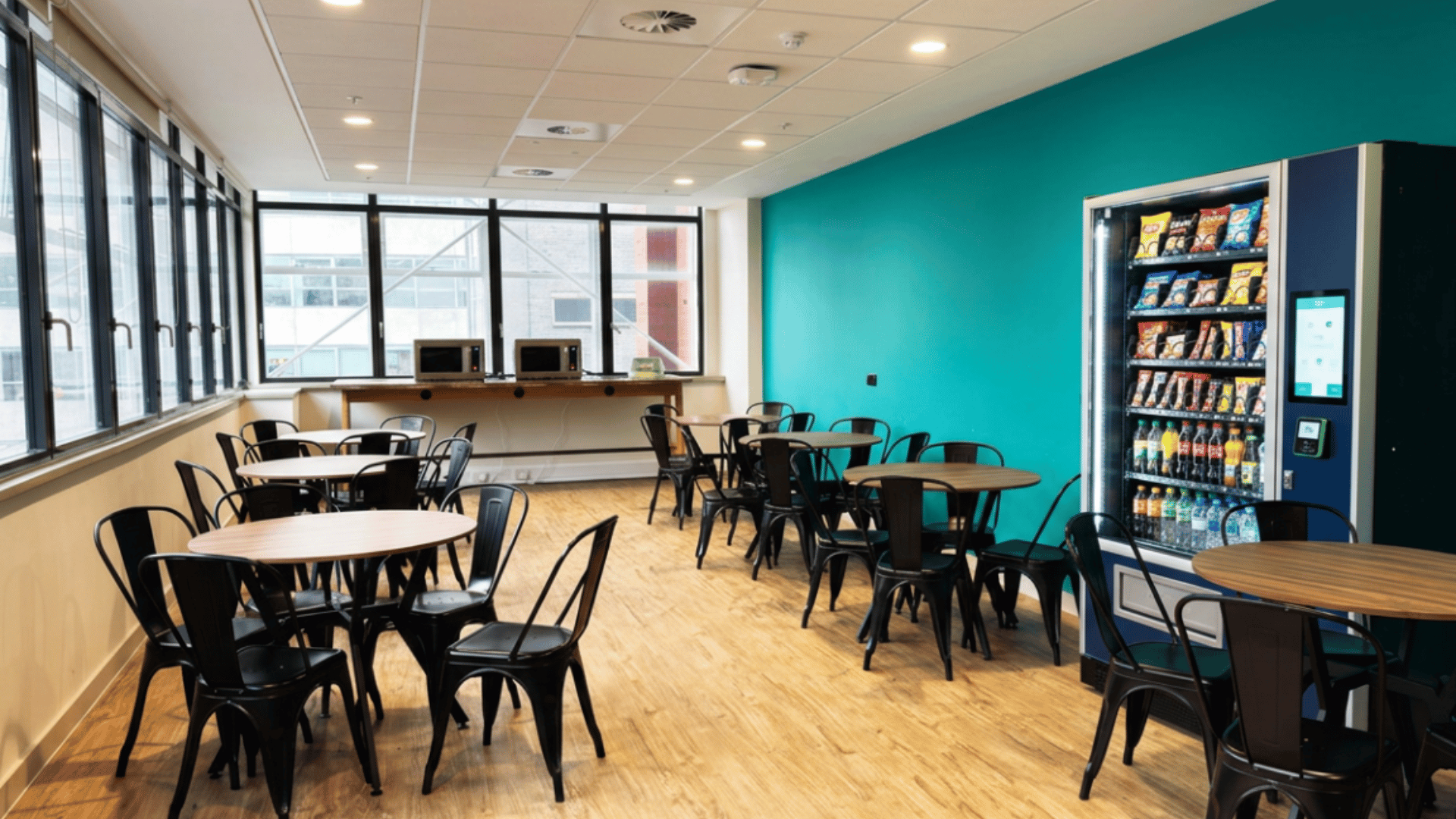 Office vending machine service providing stocked snack and beverage options for workplace employees