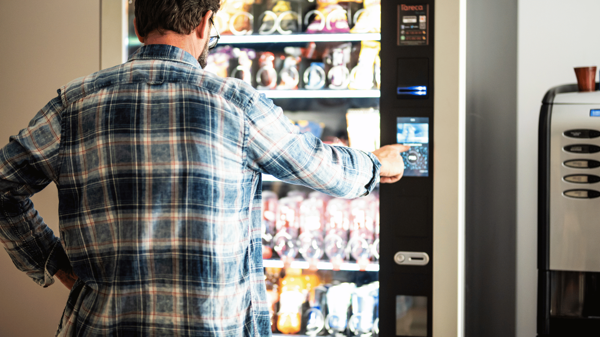 Modern commercial vending machine services with stocked snack and beverage vending machines in a professional workplace breakroom