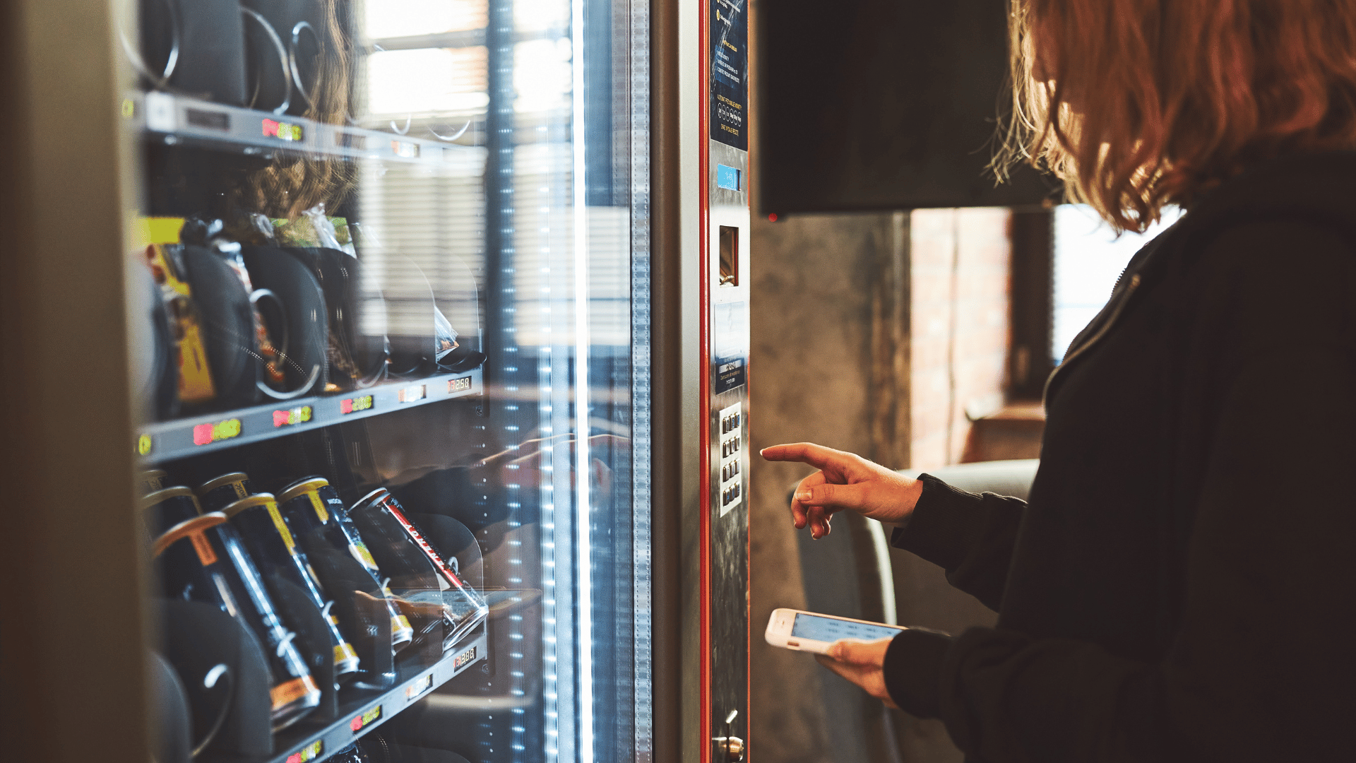 Office vending services and full service vending provider maintaining stocked machines for employee convenience.