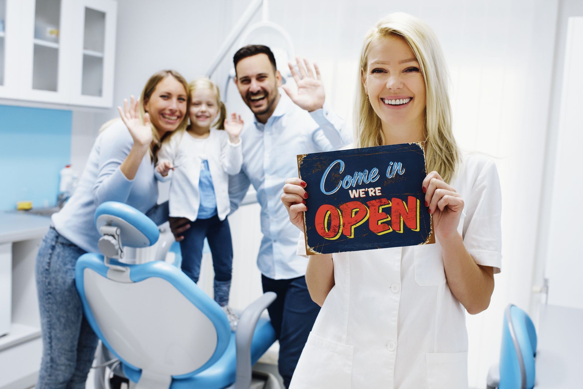 Family dentist, warm clinic setting, welcoming patients with an open sign.