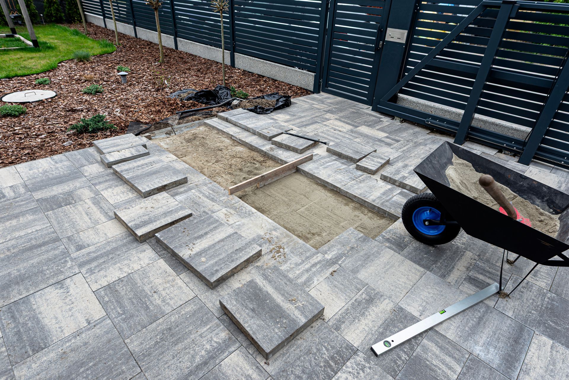 Patio materials arranged for a new paver installation