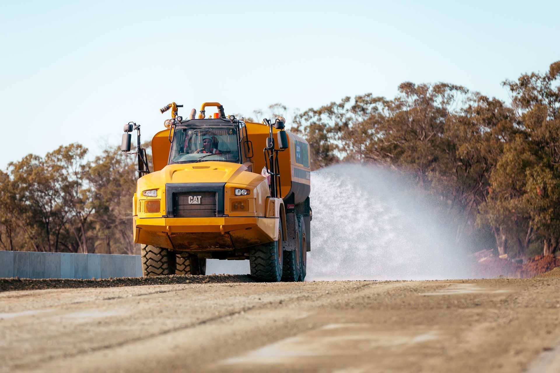 Excavator at Trailer Truck — Parkes, NSW — Steve Magill Earthmoving