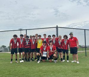 Space Coast United Soccer boys team with trophy