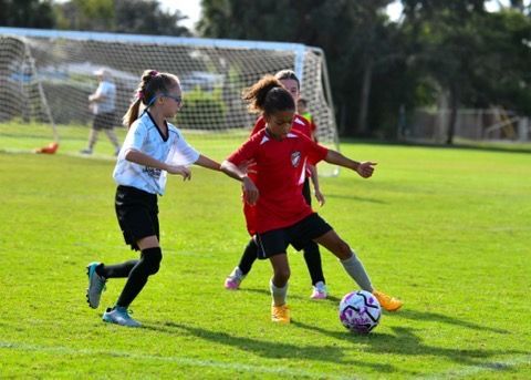 Space Coast United Soccer team huddles with coaches 