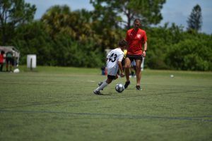Space Coast United Soccer player dribbling