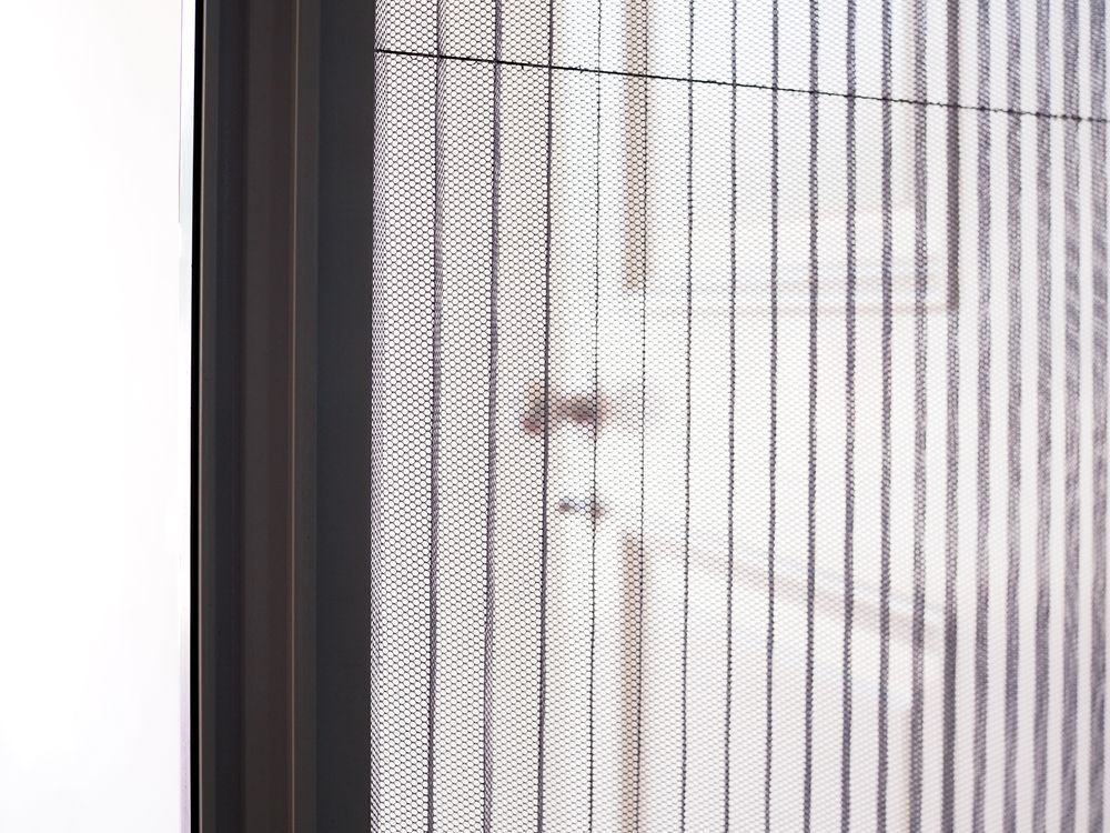 Close-up View of a Pleated Retractable Insect Screen Installed — Australian Flyscreens & Security Doors in Warners Bay, NSW