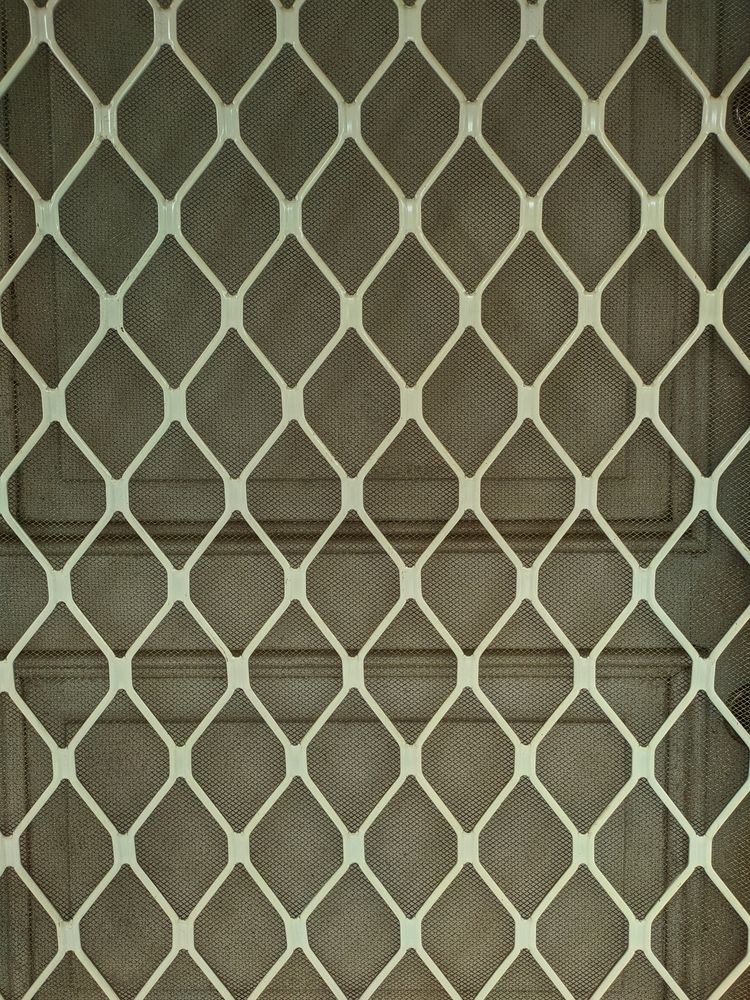 Close-up of a White Diamond-patterned Security Grille — Australian Flyscreens & Security Doors in Newcastle, NSW