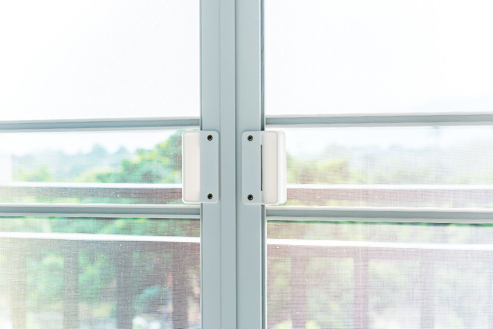 Close-up of White Window Hinges Attached — Australian Flyscreens & Security Doors in Warners Bay, NSW