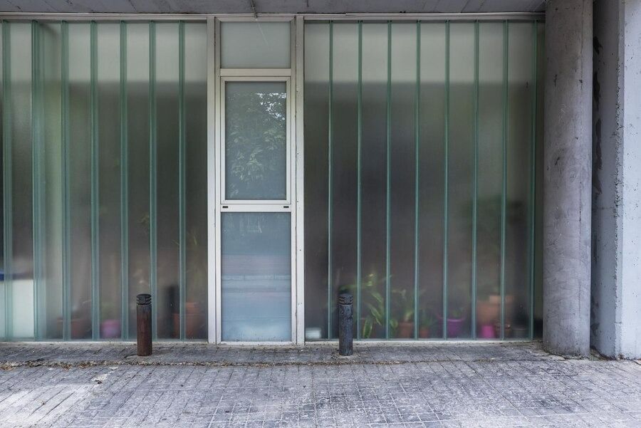 Modern Building Facade With U-shaped Channel Glass — Australian Flyscreens & Security Doors in Toronto, NSW