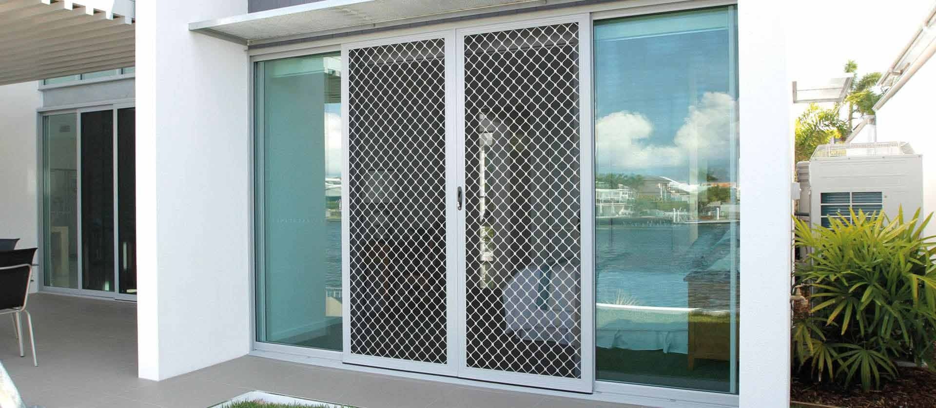 Patio Featuring a White-framed Sliding Glass Door — Australian Flyscreens & Security Doors in Toronto, NSW