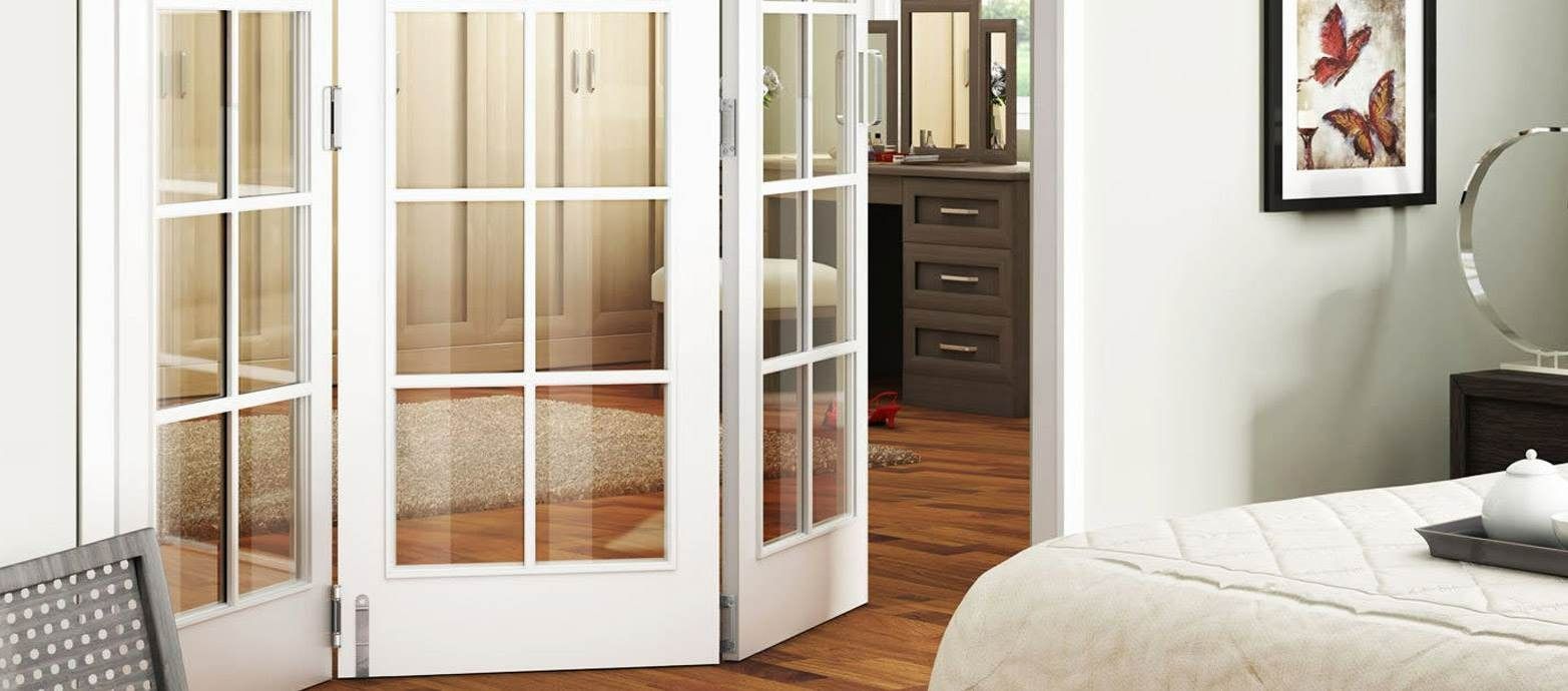 White Folding French Doors Open Into a Bedroom — Australian Flyscreens & Security Doors in Toronto, NSW