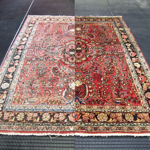 An ornate red Persian rug, divided visually to show cleaning results. 