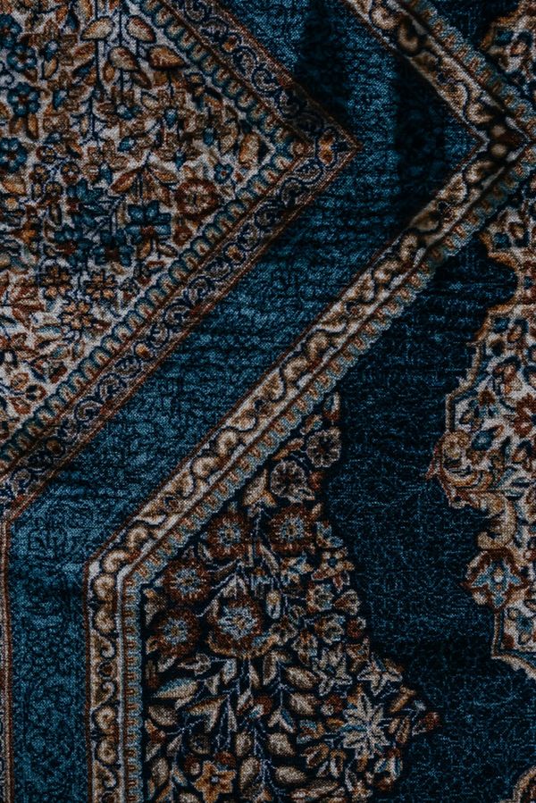 Colorful woven rugs displaying geometric patterns and tribal motifs.