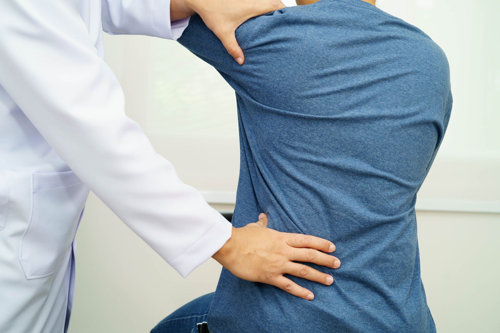doctor treating lower back pain