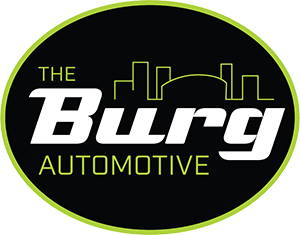 The Bury Automotive logo with black oval, neon green outline, and city skyline graphic