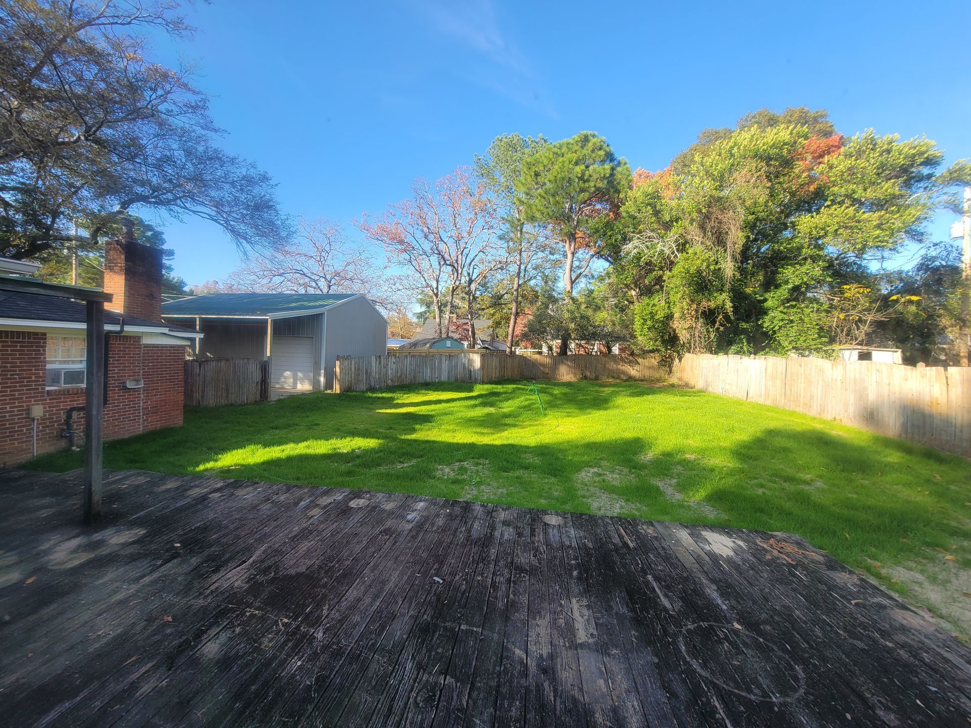 house with beautiful landscape and installed sprinkler system