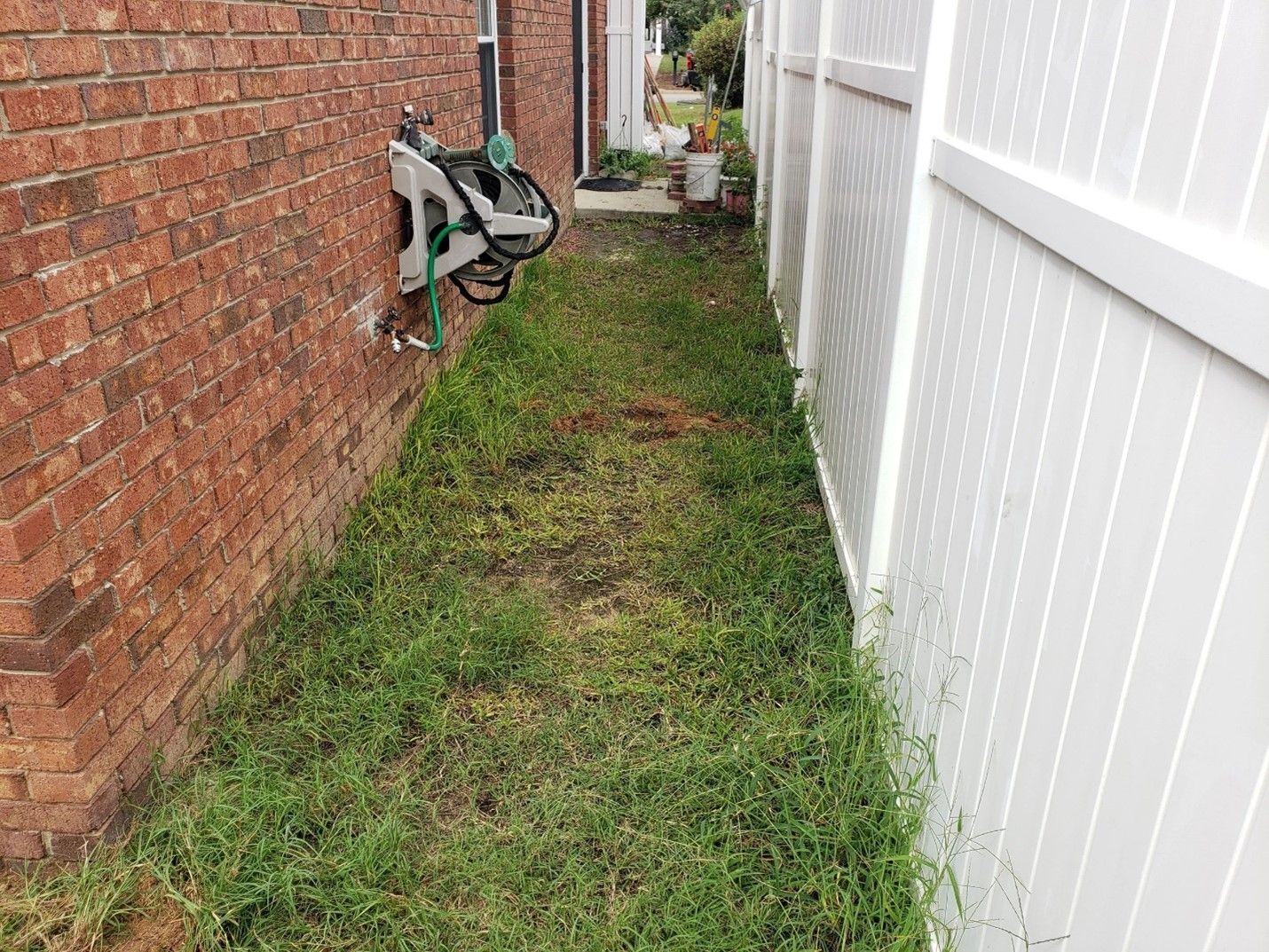 before image of walkway between the house and fence