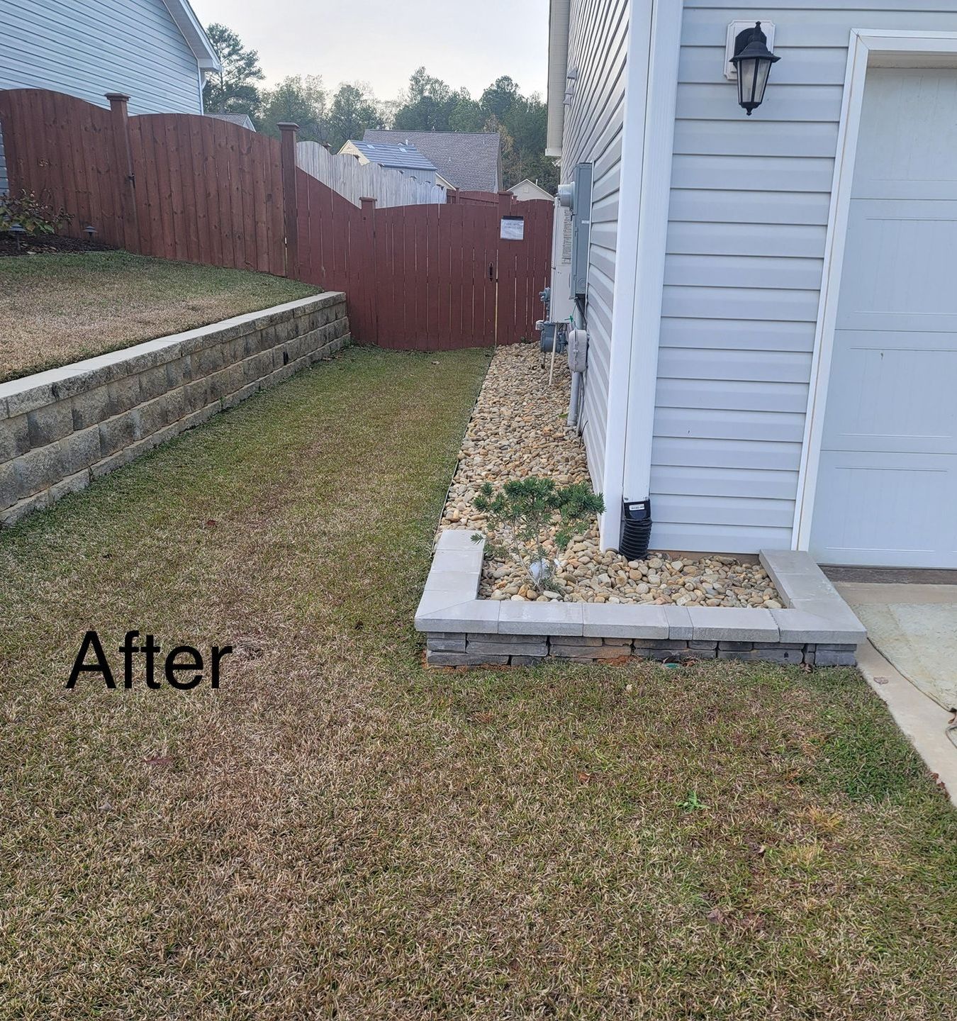 exterior view of a residential home renovated with custom concrete patio
