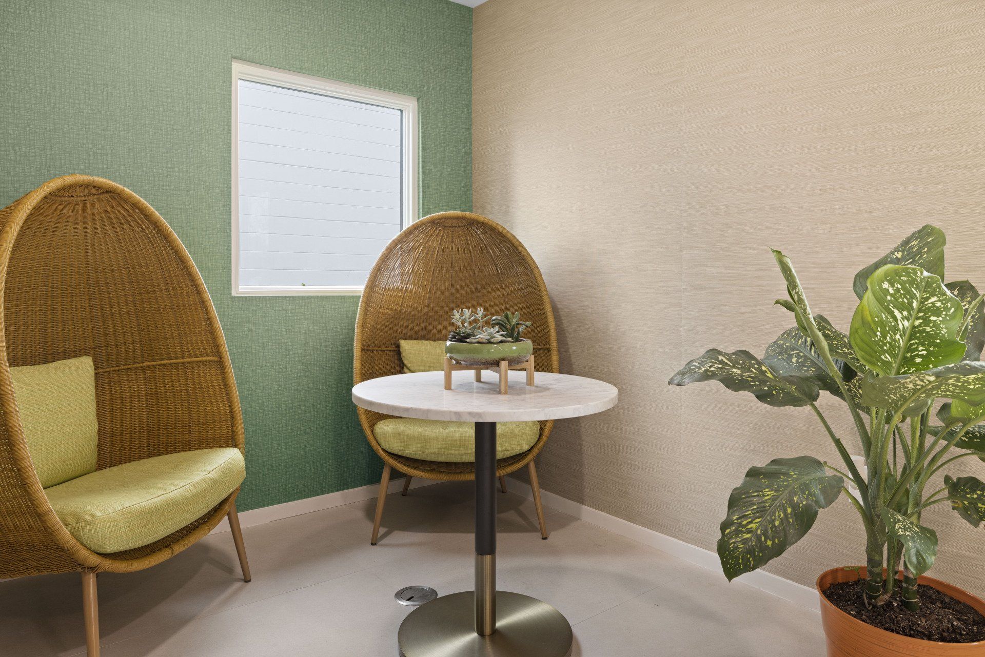 Hale Nani apartment clubhouse with luxury green sofa and coffee table.