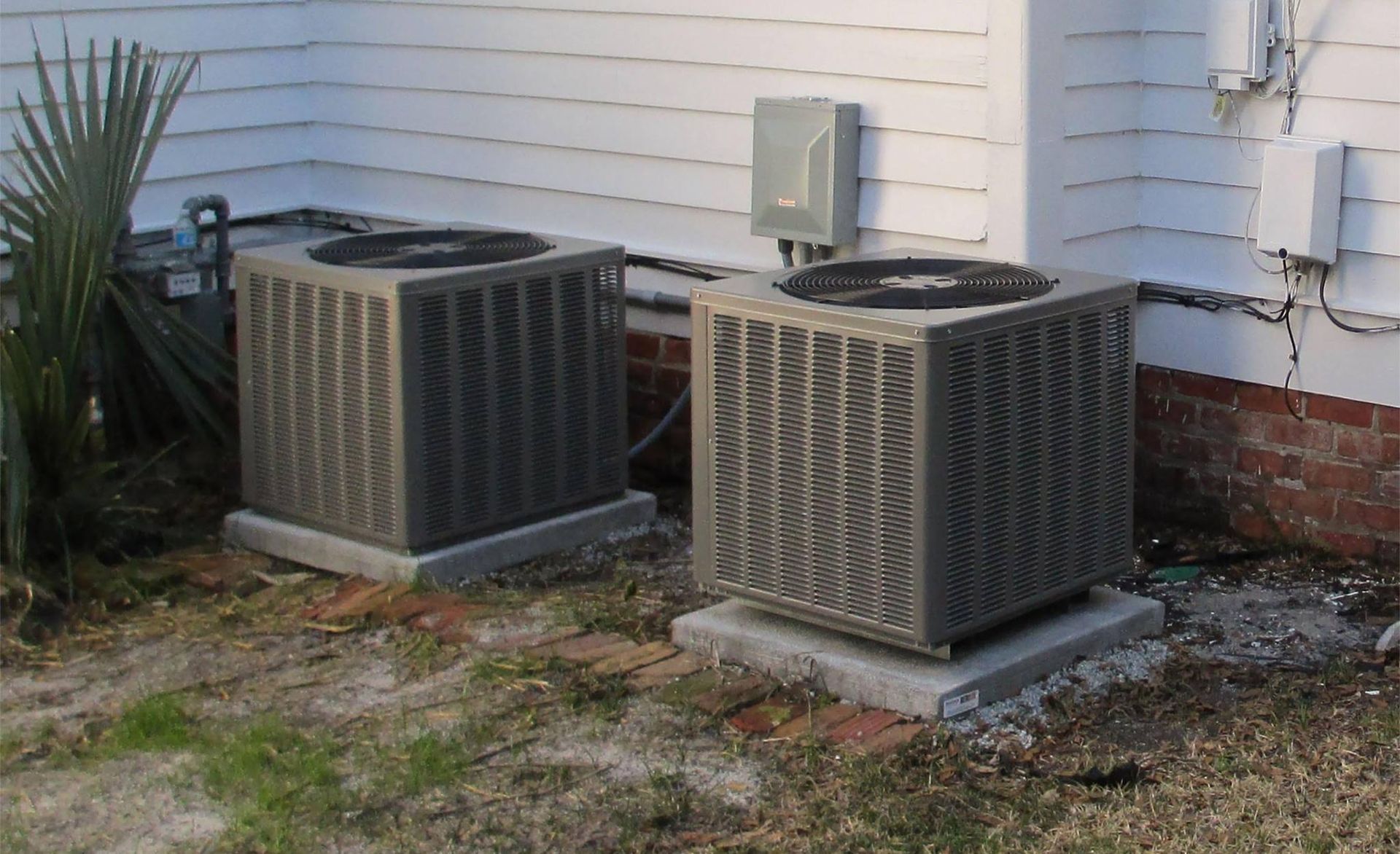 Two residential air conditioners installed by Tidewater Heating & Air Conditioning in Wilmington, NC