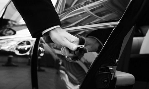 Picture of a driver at LS Autody opening the door for a client