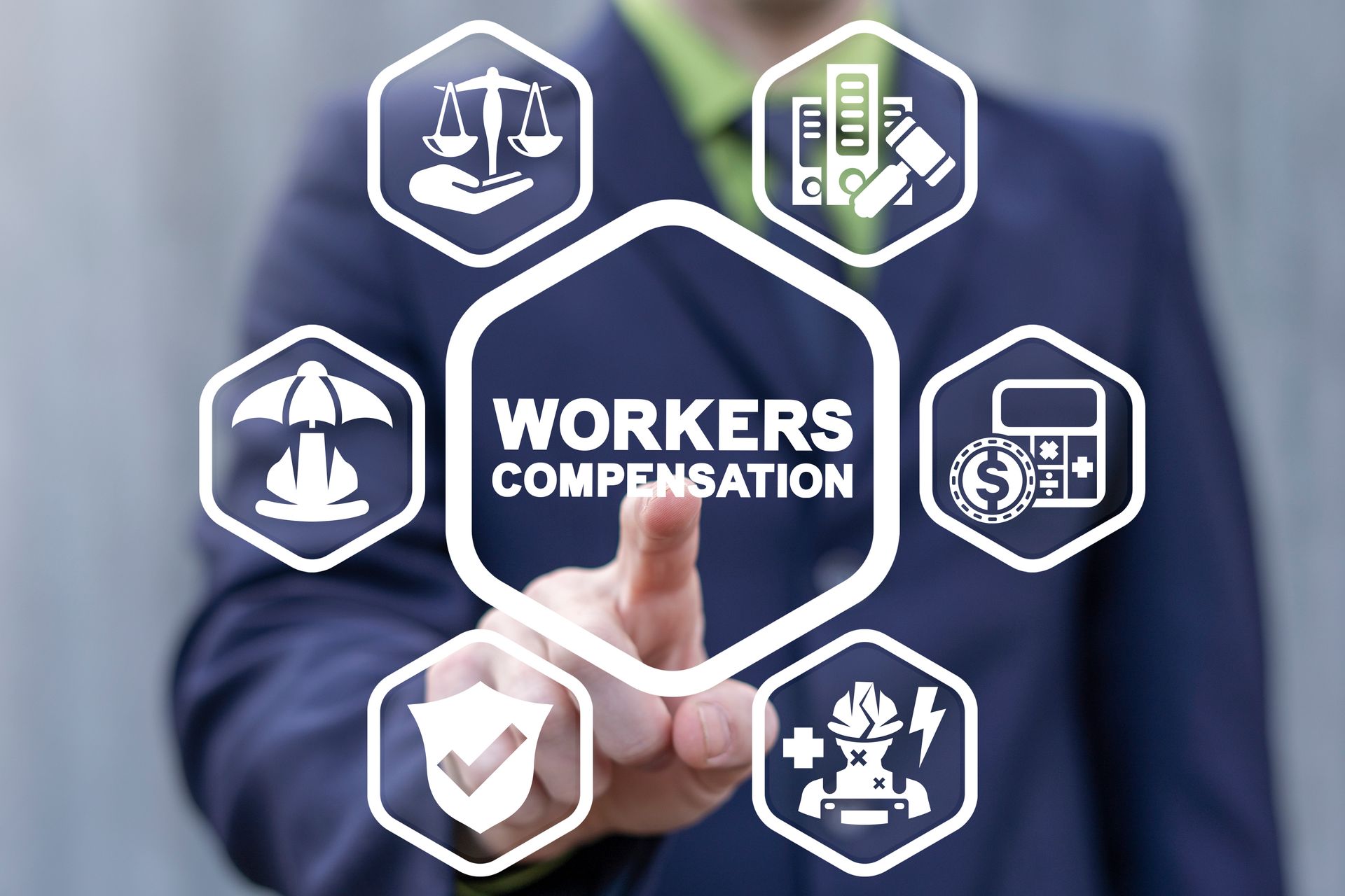 Businessman touching WORKERS COMPENSATION icons on a digital interface