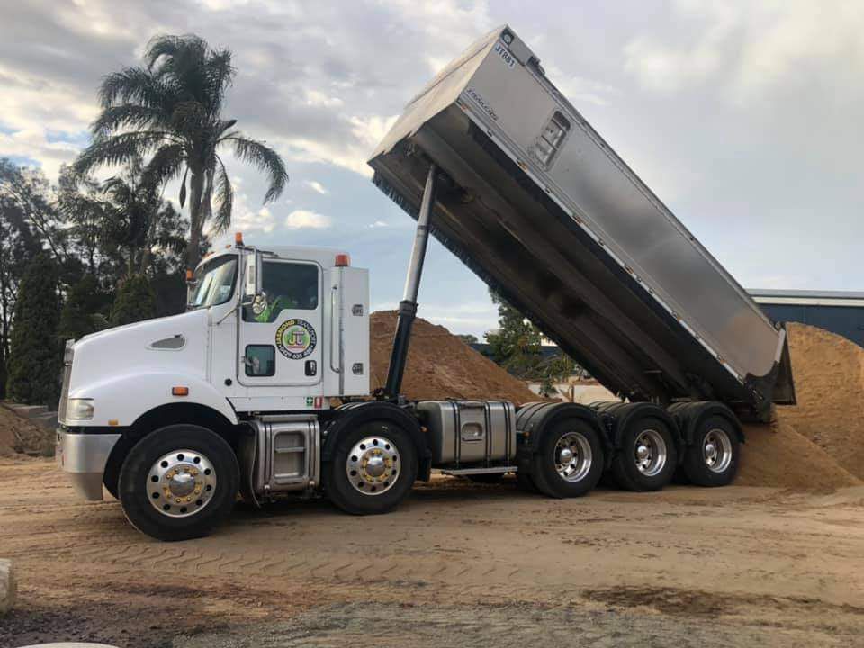 White dump truck in a quarry | Toowoomba, QLD | Jasmond Transport