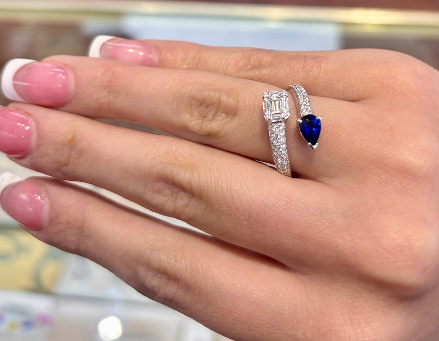 A close up of a woman 's hand with a ring on it