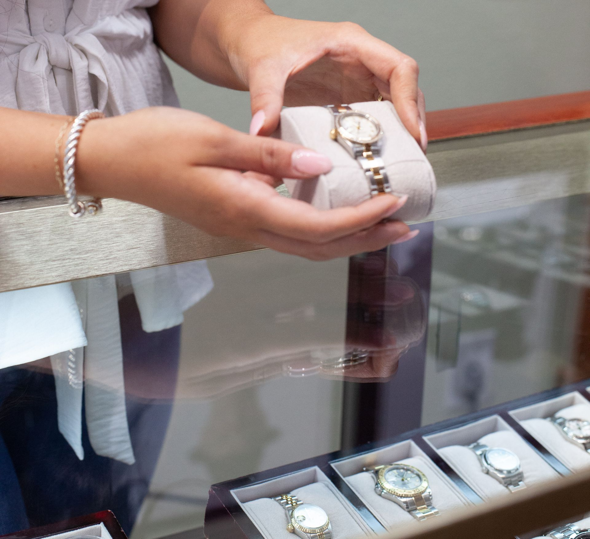 woman choosing a necklace at the jewelry store