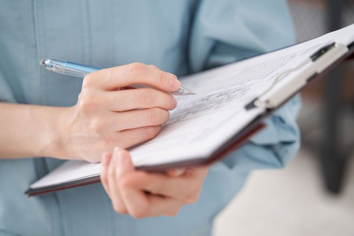 Writing on checklist — Superior, WI — Northland Home Inspections