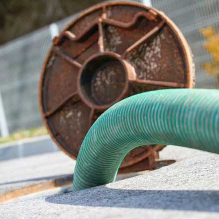Hose in sewer — Superior, WI — Northland Home Inspections Hose in sewer — Superior, WI — Northland Home Inspections