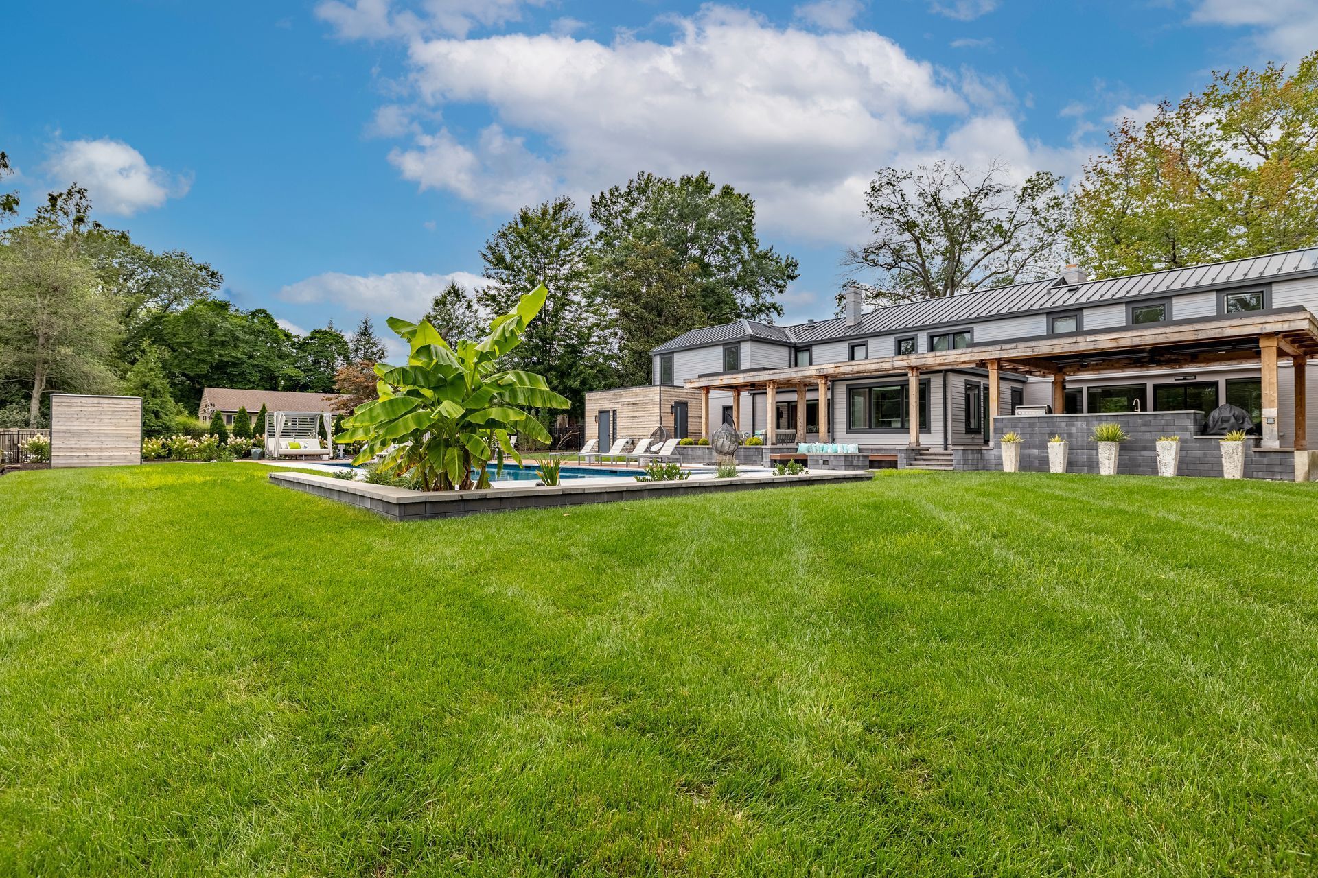 A large house with a large lawn in front of it.