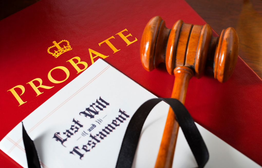 Probate and last will document with a gavel on a red background