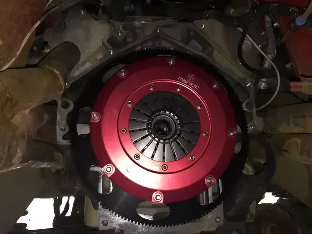 A Close Up of a Red Clutch on a Car Engine — Land Rover Spares In Mackay, QLD