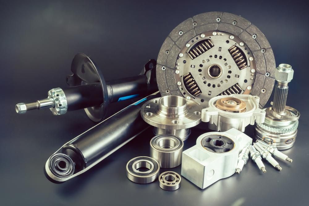 A Bunch of Car Parts Are Sitting on a Table — Land Rover Spares In Mackay, QLD