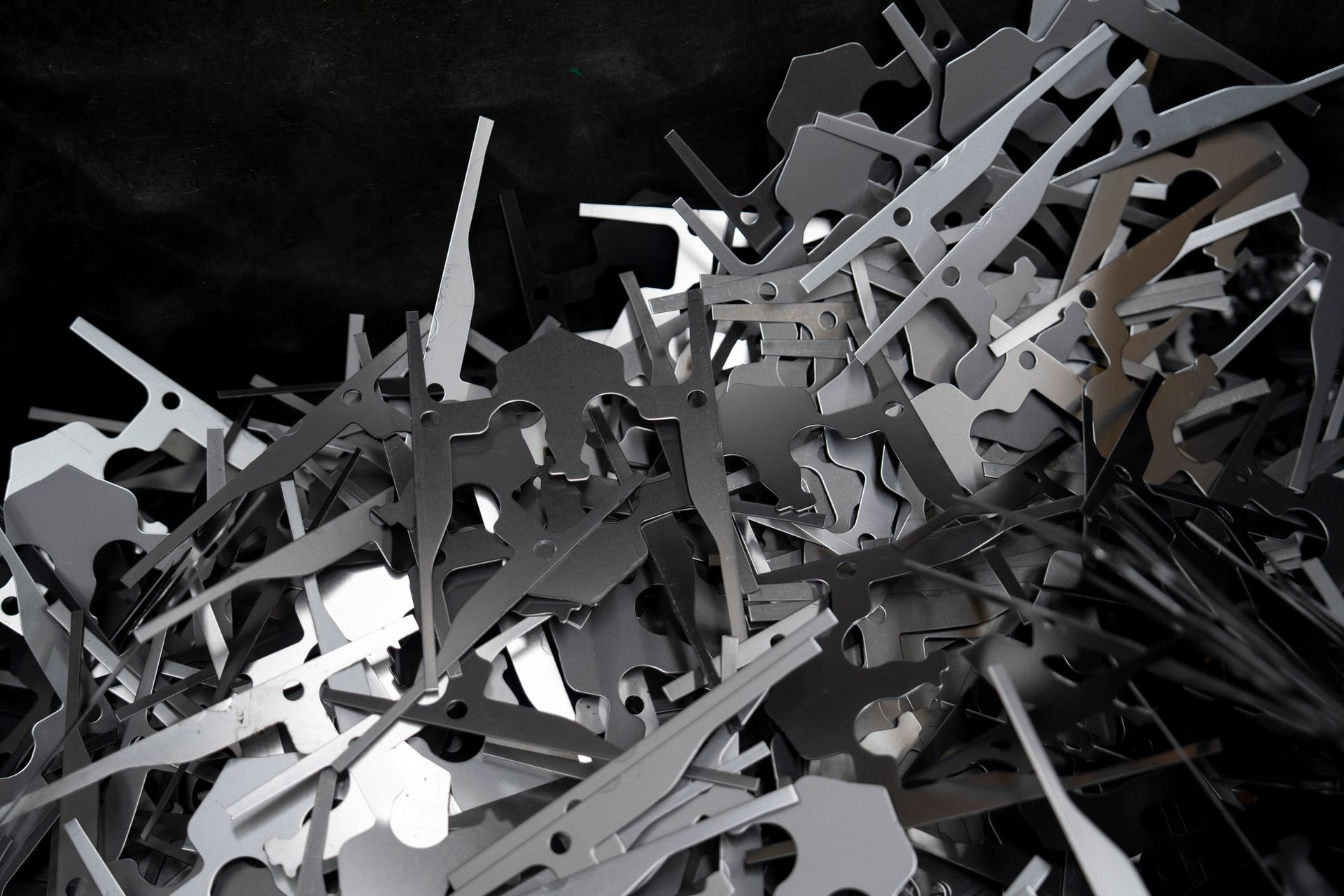 Close up photo of silver color scrap metal and metal trash
