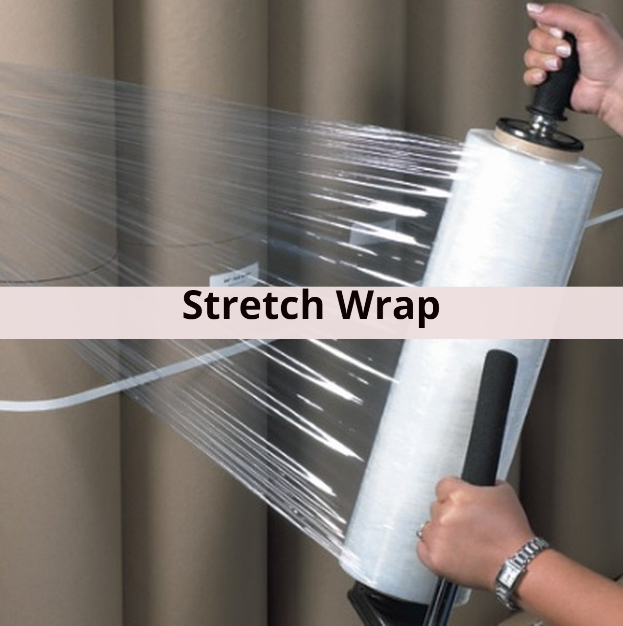 A person is holding a roll of stretch wrap
