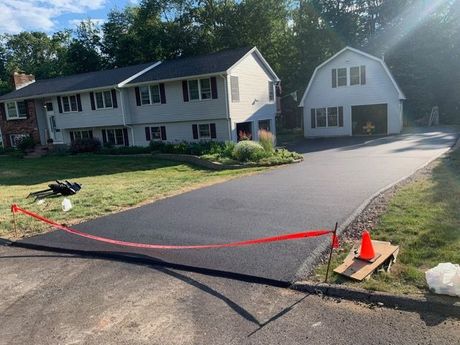 Workers On Asphalting Road — Glastonbury, CT — American USA Paving